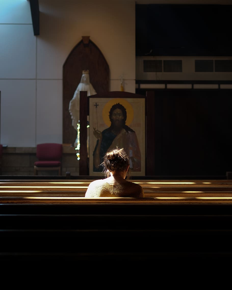 HD   Woman Sitting On Church Pew During Daytime One Animal   Woman Sitting On Church Pew During Daytime 