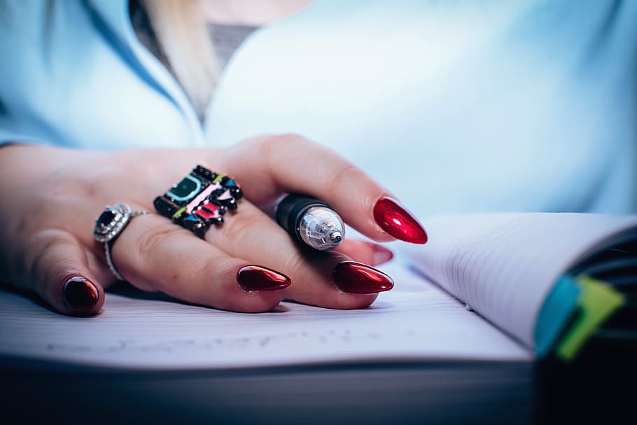 Person With Red Nail Polish Holding Black Pen, close-up, hand HD wallpaper