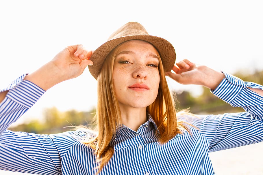 Woman Wearing Brown Hat and Blue Striped Dress Shirt, attractive
