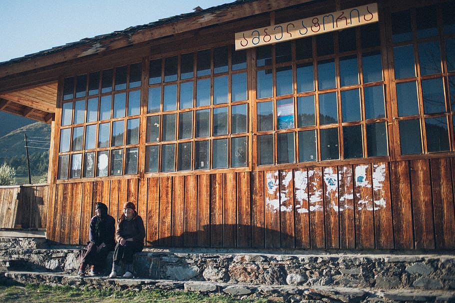 2 Person Sitting by Cabin, architecture, daylight, glass windows HD wallpaper