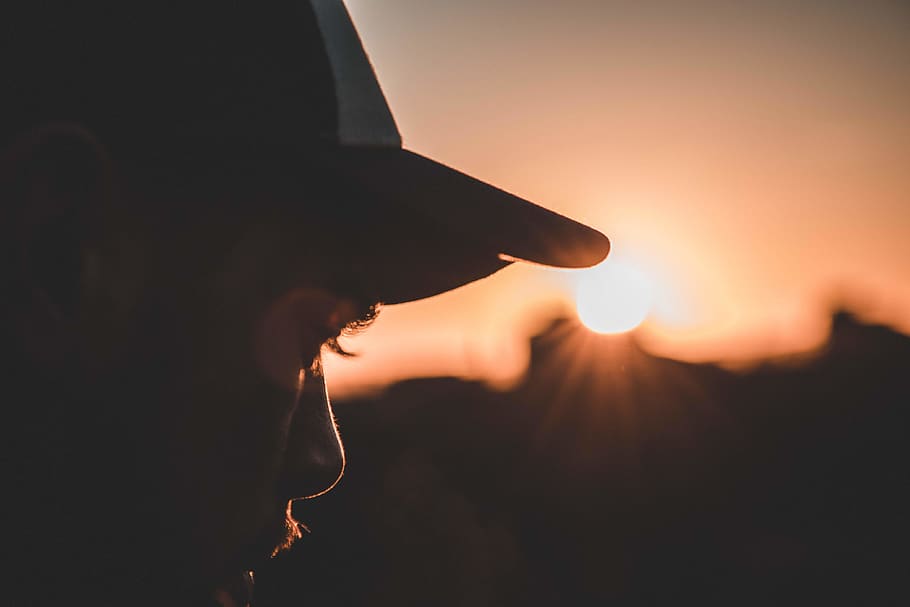 man wearing cap, apparel, clothing, light, flare, silhouette HD wallpaper