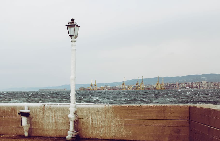 italy, muggia, pole, wind, light pole, sea, wave, ice, water HD wallpaper