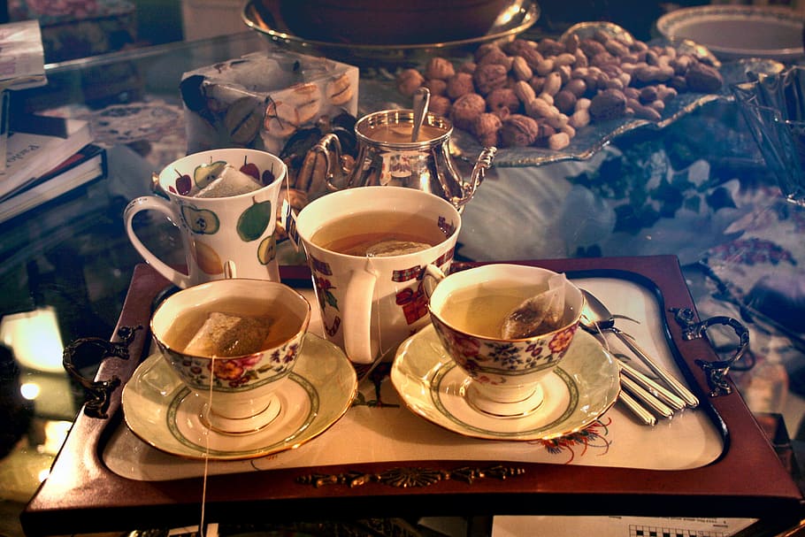 Breakfast Tea Cups Filled With Water, Milk and Tea Bags, beverage