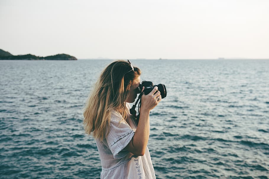 Woman Taking Photo of Ocean, beach, calm, camera, chill, enjoyment HD wallpaper