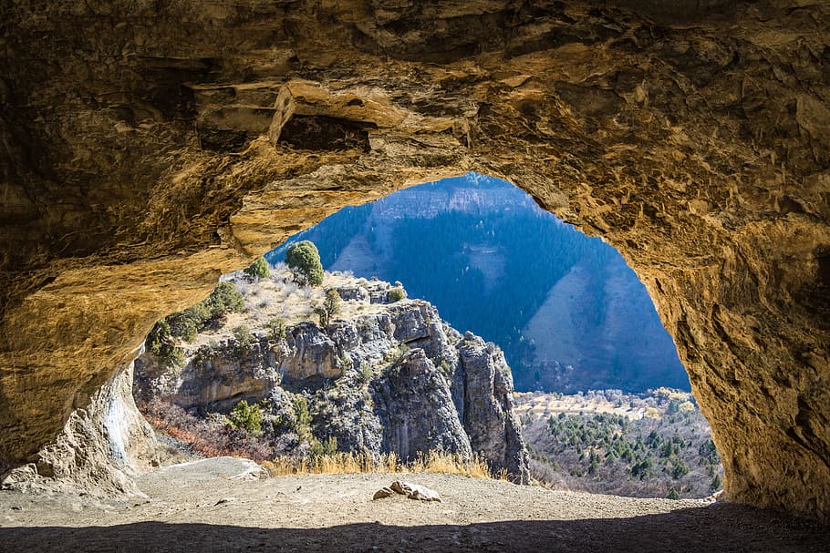 gray mountain during daytime, cave, rock, look, view, through