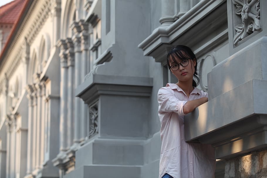 Woman Standing Near Gray Wall, architecture, beautiful, building HD wallpaper