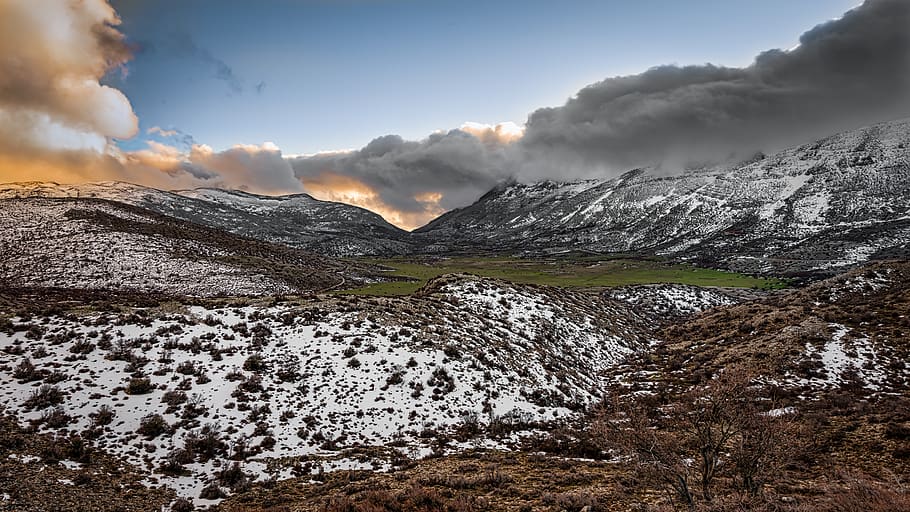 Scenic Photography of Mountains Covered With Snow Under Cloudy Sky HD wallpaper