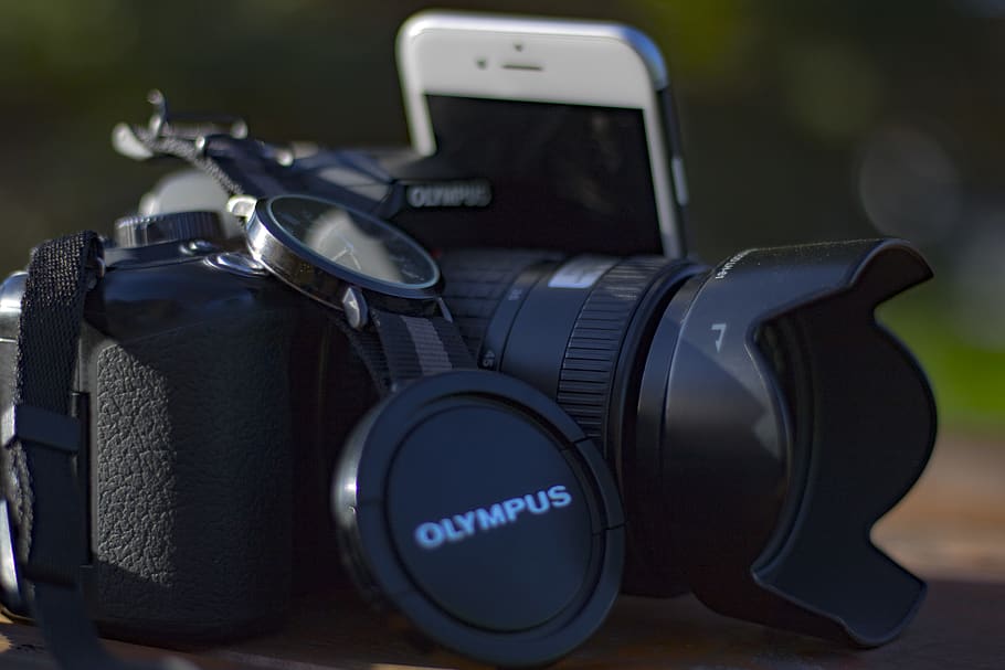 Black Olympus Dslr Camera Beside Silver Iphone 6, action, close-up HD wallpaper