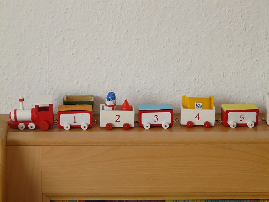 Plastic Toy Train on Wooden Rack, child, design, education, furniture