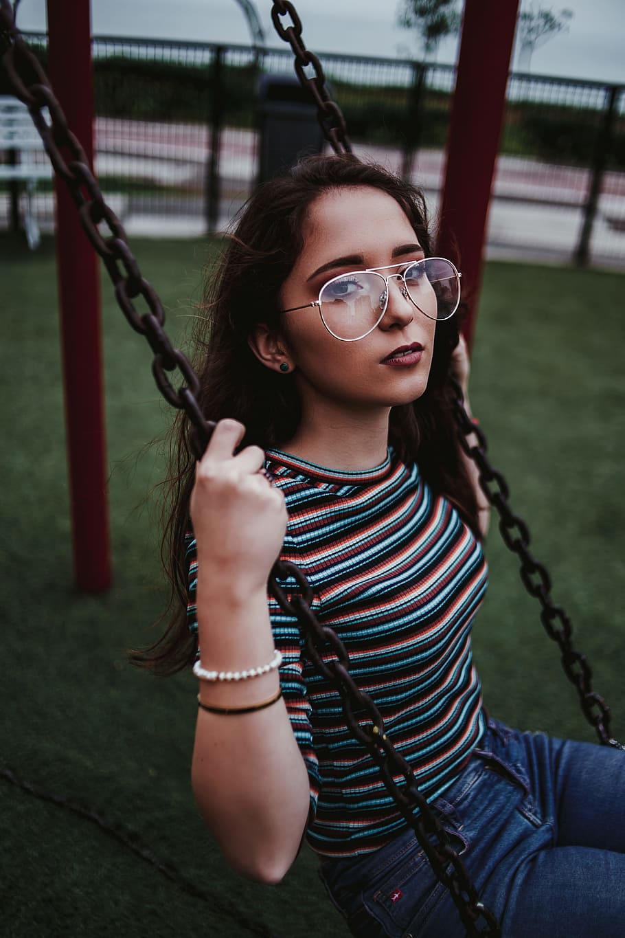 woman sits on swing, female, glasses, fashion, style, model, pose