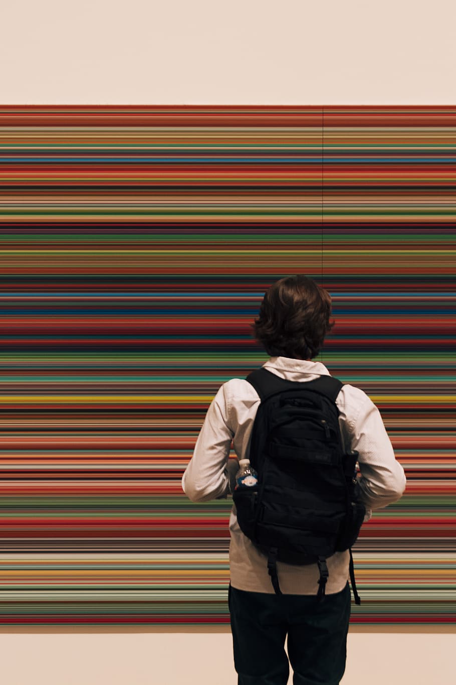 man standing on floor while wearing black backpack, human, person HD wallpaper