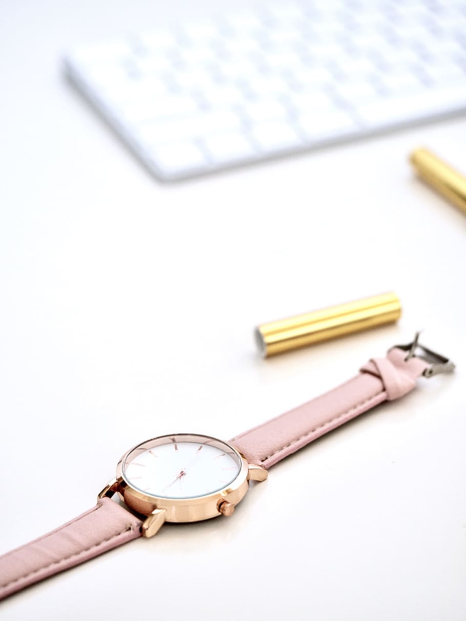 round gold-colored framed analog watch on white surface, keyboard HD wallpaper