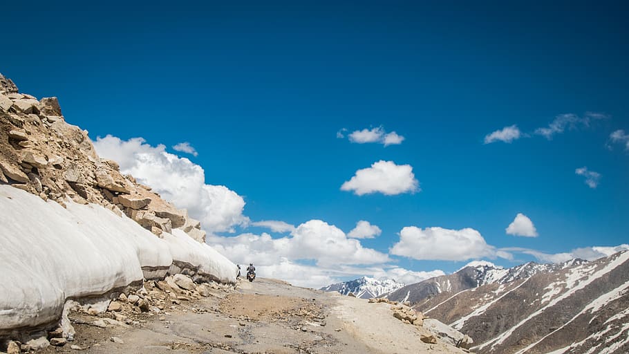 rocky road surrounded with mountains, sky, scenics - nature, beauty in nature HD wallpaper