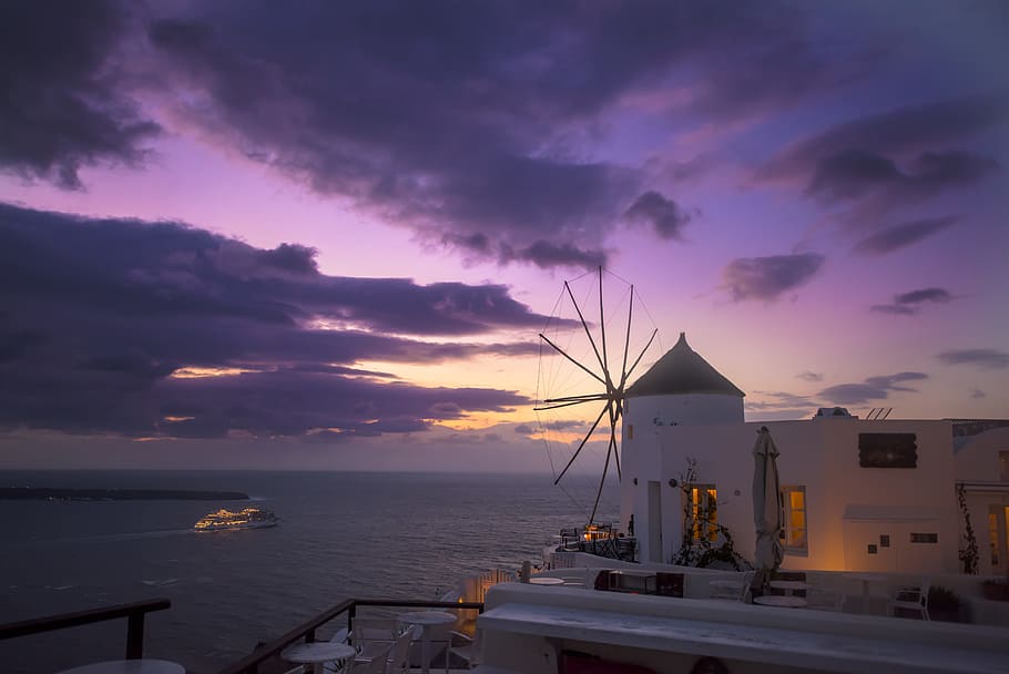 white concrete building near ocean, water, cloudscape, sunset HD wallpaper