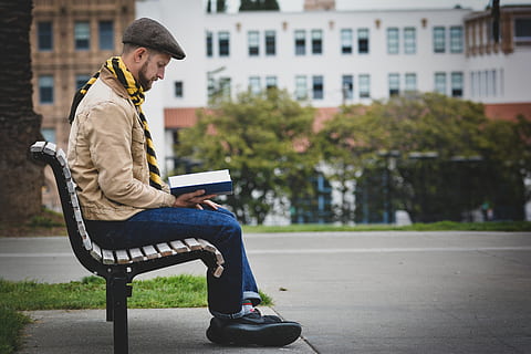 man reading book while sitting on bench outdoors, person, human HD wallpaper
