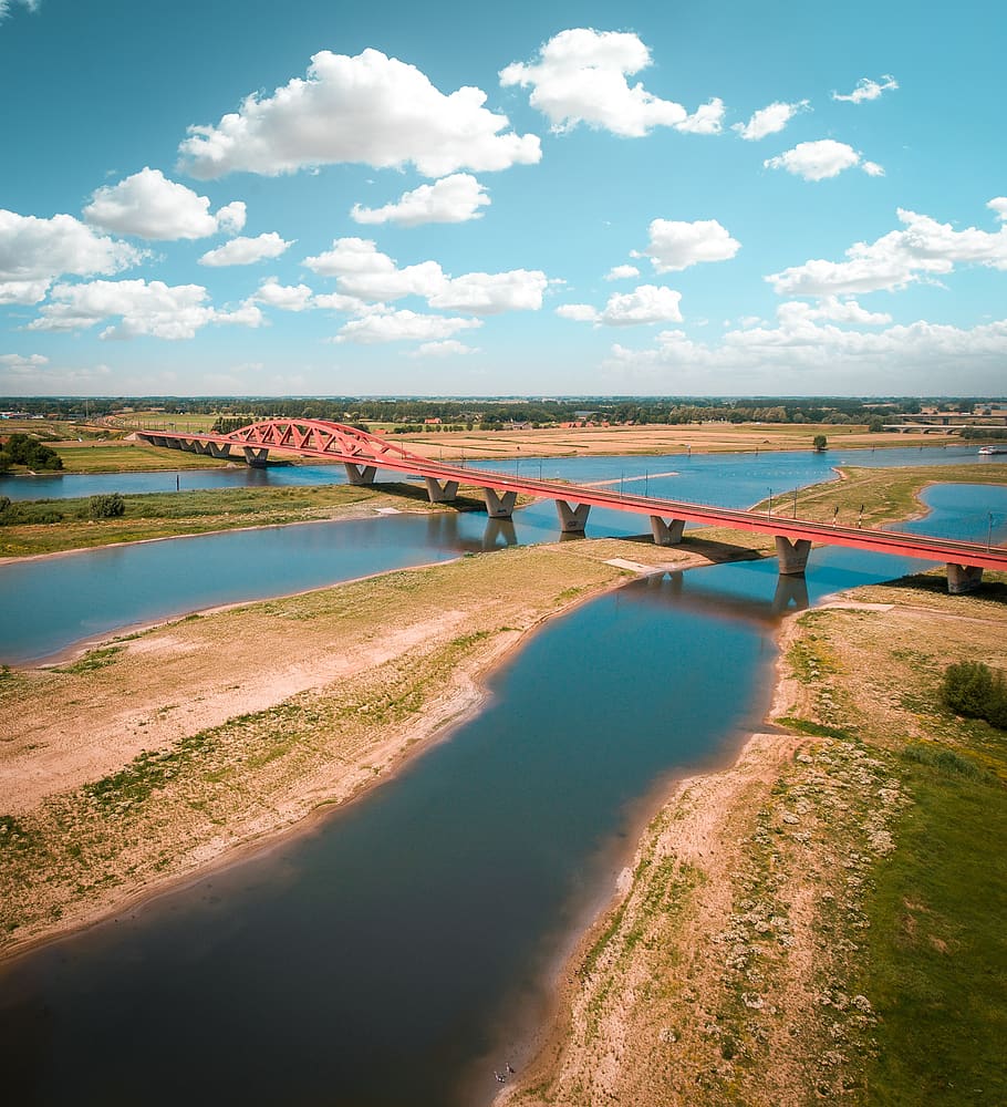 bridge, red, water, blue, grass, green, lake, river, train HD wallpaper