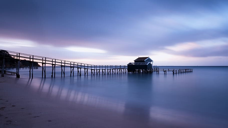 Gray Skies over the Ocean Water and Beach Sand, pier, sea, seascape HD wallpaper