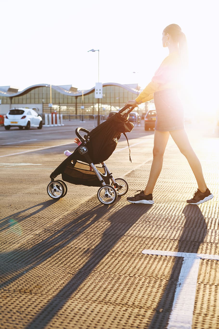 Photo of Woman Pushing a Stroller, adult, daylight, female, lady