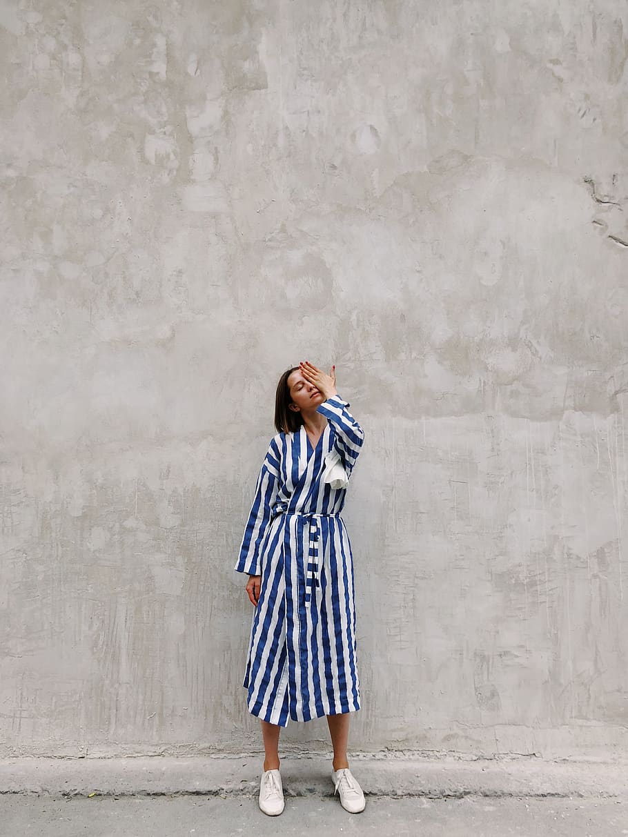 Woman in Blue and White Striped Dress Covering Her Left Eye, concrete HD wallpaper