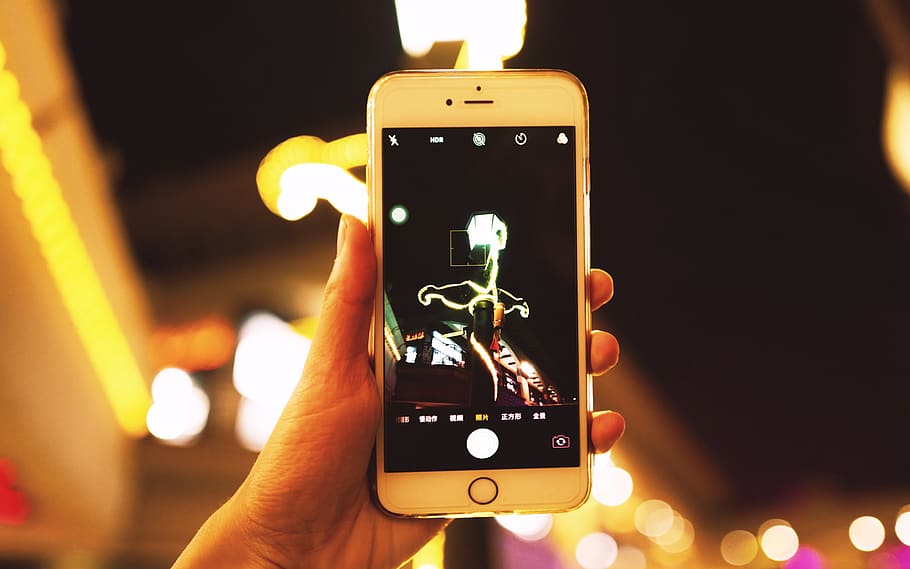 Person Holding Iphone, macro, screen, smartphone, technology HD wallpaper