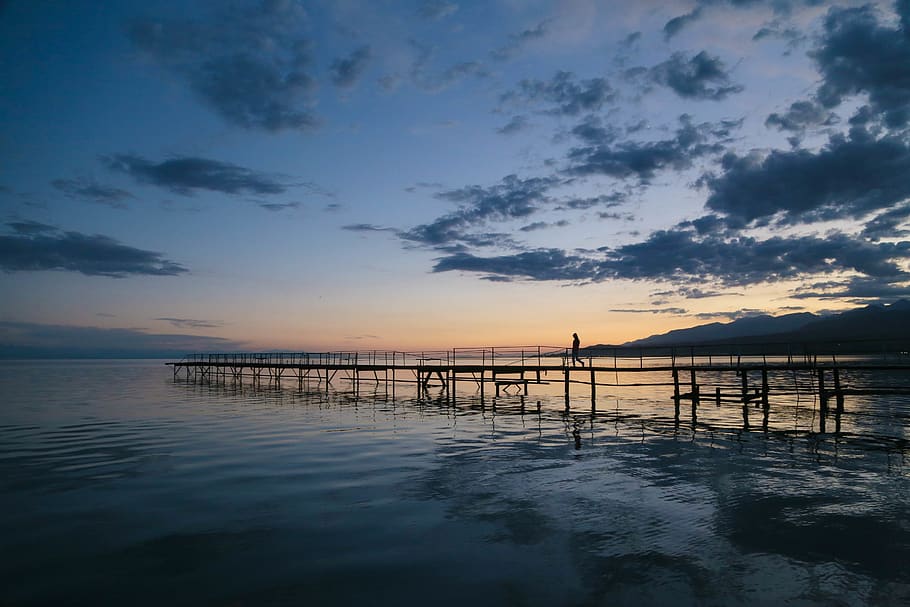 Photo of Person Walking on Dock, beach, bridge, clouds, dawn HD wallpaper