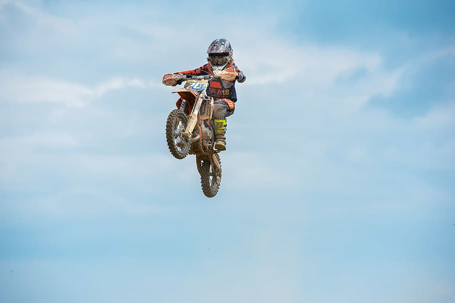 man riding motorcycle, sport, mid-air, one person, extreme sports HD wallpaper
