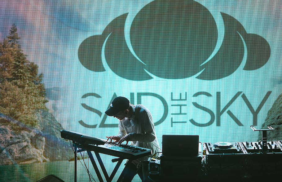 man playing electronic keyboard on stage, music, united states