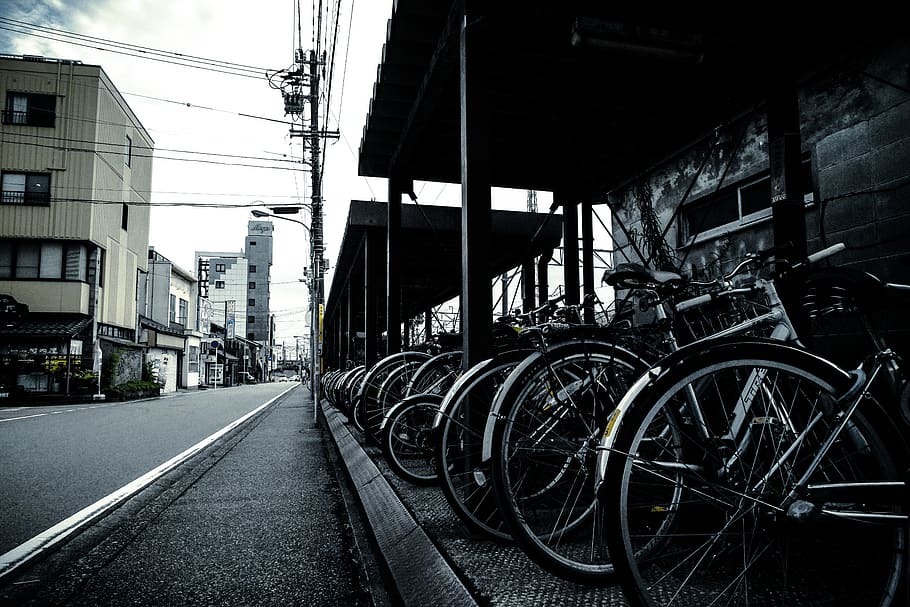 Grayscale Photography of Bikes Park Outside, bicycles, building HD wallpaper