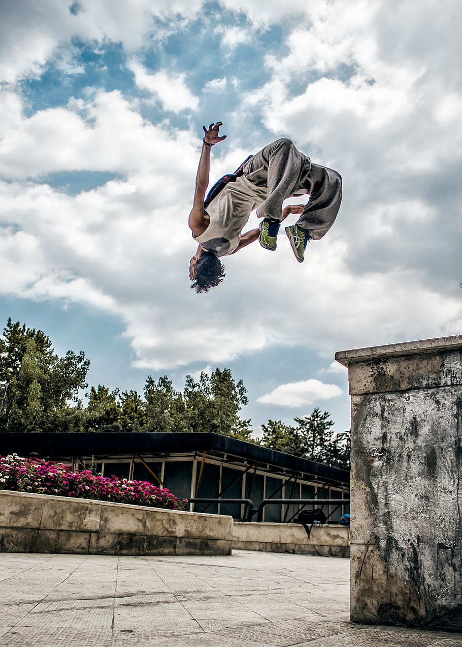 man wearing gray pants, sky, cloud - sky, jumping, mid-air, full length HD wallpaper