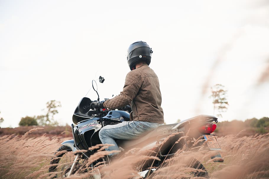 man riding motorcycle, leisure activity, helmet, one person, sitting HD wallpaper