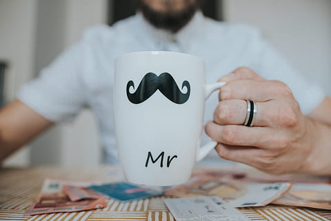 Person Holding White Mr. Ceramic Mug, blurred background, close-up HD wallpaper