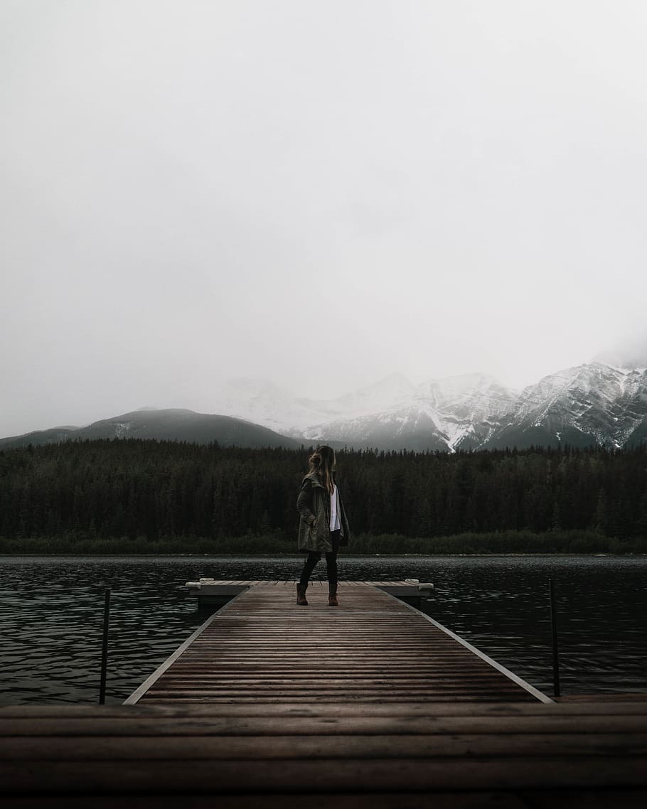 Person Standing on Sea Dock Under White Sky, daylight, environment HD wallpaper