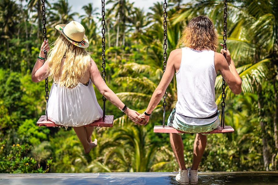 Back View Photo of Couple on Swings Holding Hands, embrace, in love, HD wallpaper