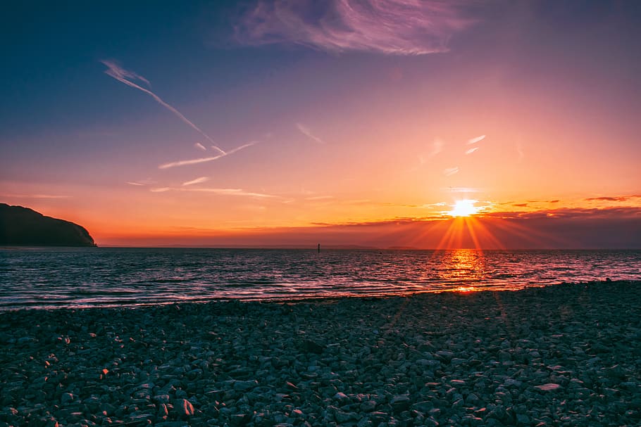 Stone Seashore Under Golden Hour Wallpaper, beach, clouds, evening HD wallpaper