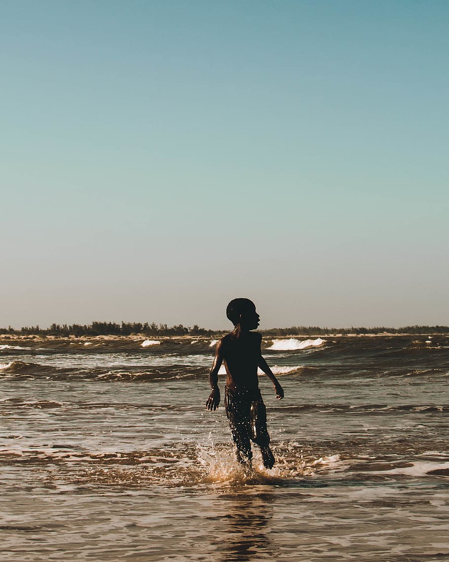Boy on Body of Water, beach, child, daylight, enjoyment, horizon HD wallpaper