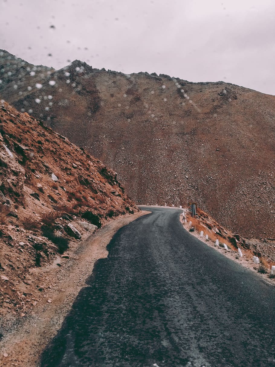 Asphalt Road Beside Rock Formation, cliffs, daylight, daytime HD wallpaper