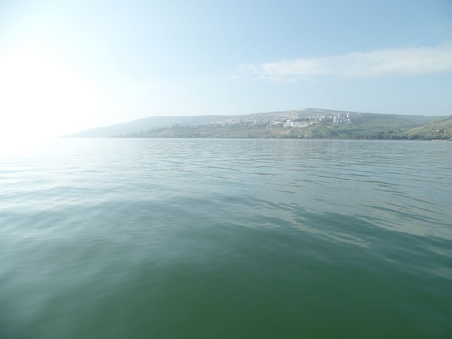 A bright sky over an ocean., israel, sea of galilee, christian