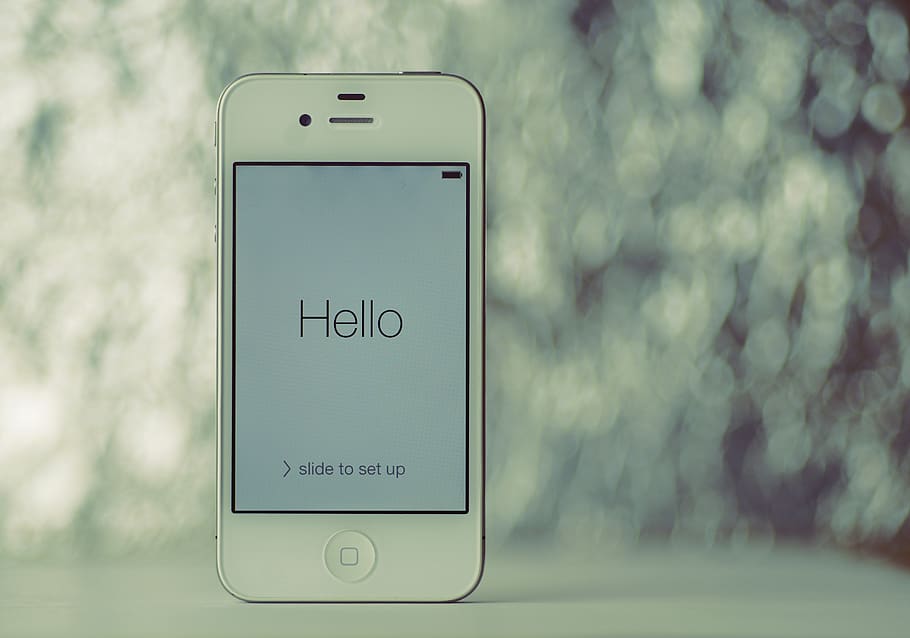 turned-on white iPhone 4 with Hello wallpaper, communication HD wallpaper
