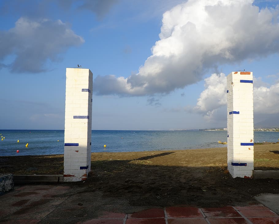 columns, clouds, seaside, horizon, view, beach, shadows, sand HD wallpaper