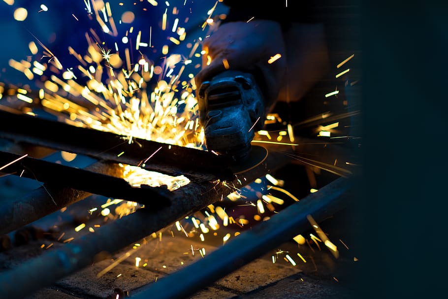 person using angle grinder, metal, sparks, blurred motion, metal industry HD wallpaper