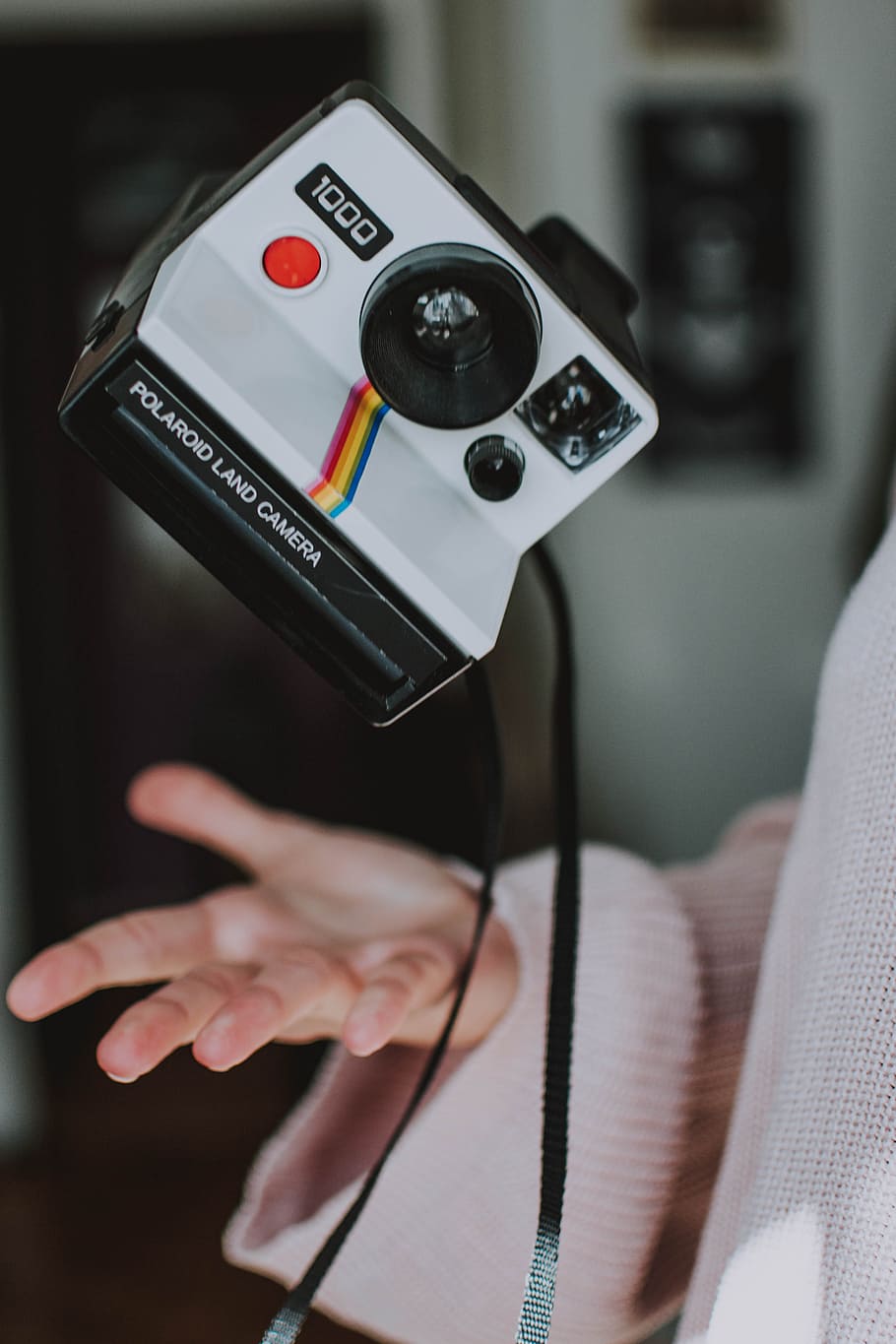 white Polaroid instant camera, levitation, retro, polaroid camera