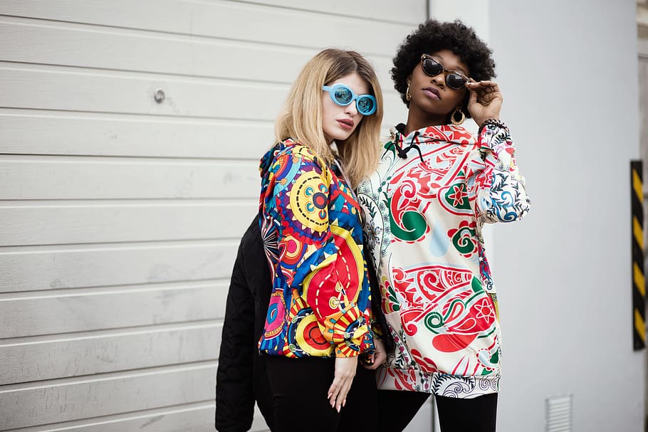 Two Women Standing Near Roller Shutter, beautiful, bright colours