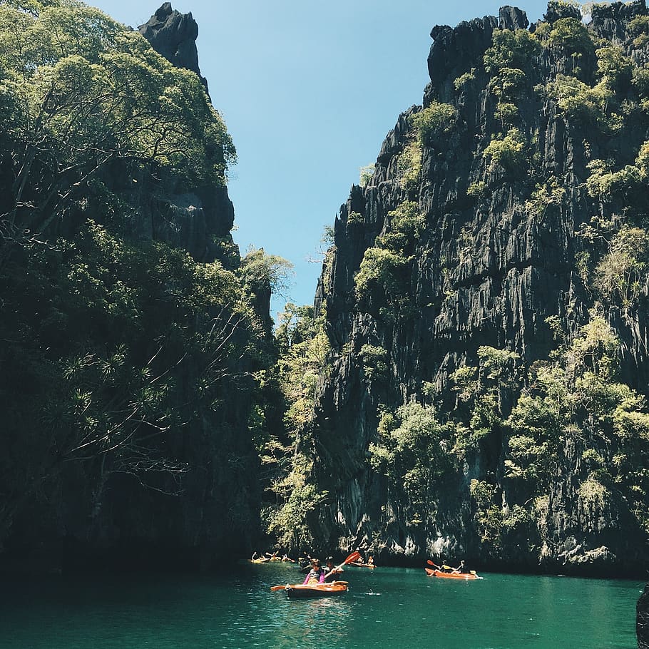 Group of People Riding on Kayak Near Stone Mountain, asia, bay HD wallpaper