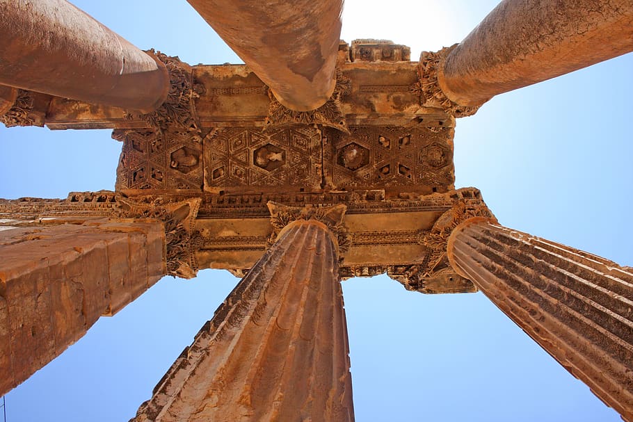 low angle photography of brown pillars, temple, architecture