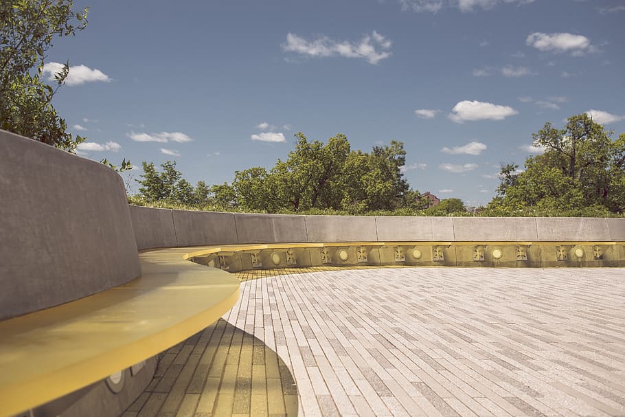 bench, seating, stones, concrete, trees, sky, clouds, plant HD wallpaper
