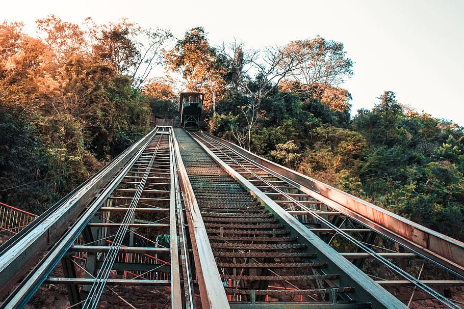 Grey Steel Railroad Across Mountain, daylight, daytime, forest HD wallpaper