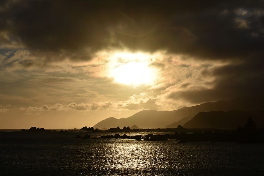 sunset, sea, coast, mountains, horizon, orange, mood, dusk HD wallpaper