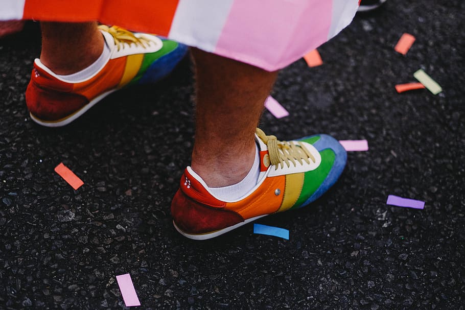 person wearing multicolored low-top shoes standing on ground, HD wallpaper
