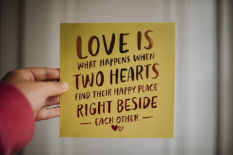 Love is what happens when two hearts find their happy place right bedside each other