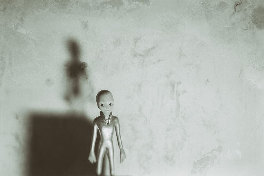 alien, toy, stylised, grunge, background, one person, childhood